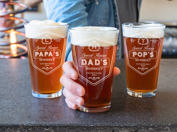 Three engraved pint beer glasses