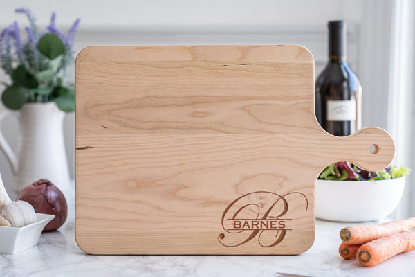 Wooden cutting board with monogram