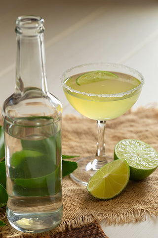 Cocktail and lime wedges