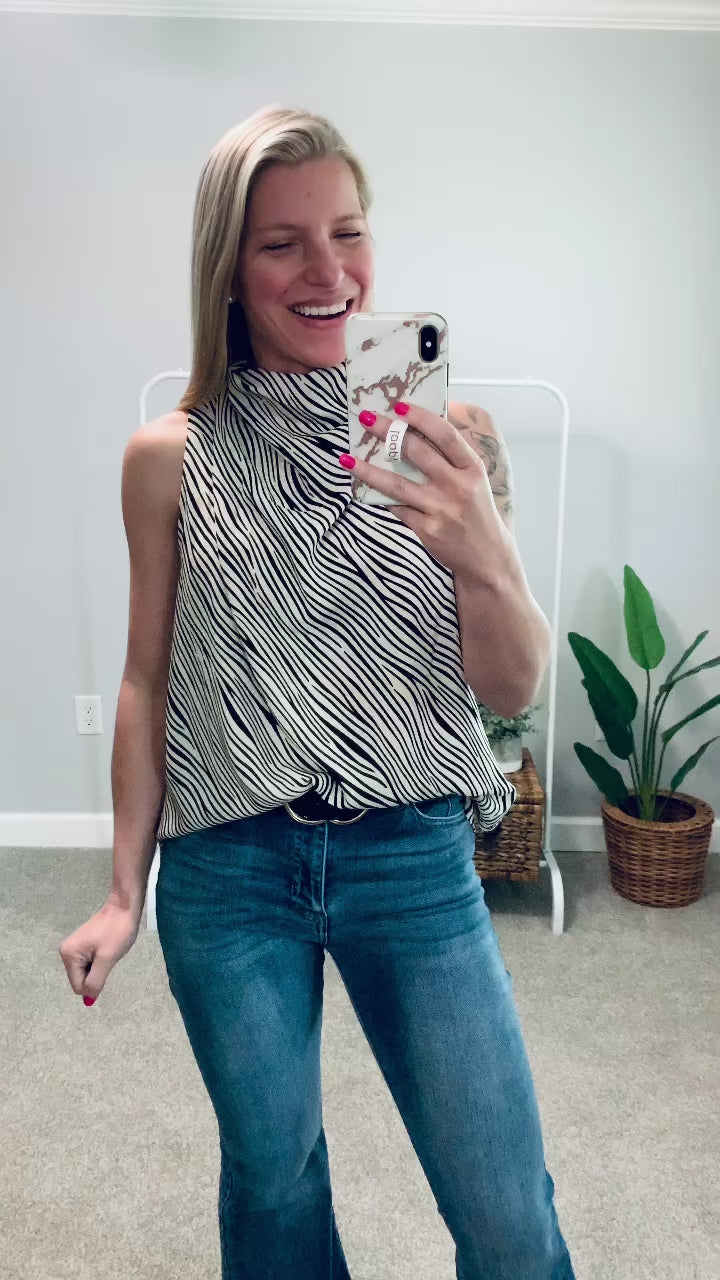 We're loving the chic, cool girl vibes, of our Cowl Neck Sleeveless Top!  This effortless styled top features a cowl neck, double button closure at back of neck, and a gorgeous draped silhouette. This best selling top is perfect for the workplace or for a date night outfit! Entro Clothing.