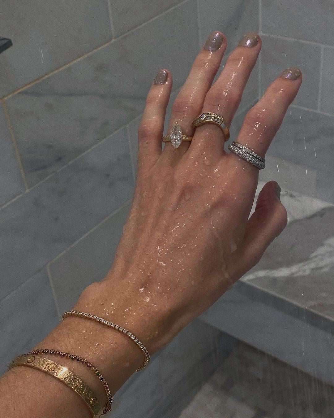 alt="Kinn Franco Curved Ring and Diana Diamond Tennis Bracelet both worn in the shower"