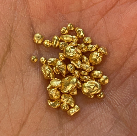 alt="pieces of gold to be melted and used for new jewelry"