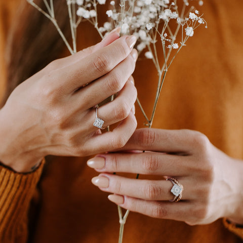 white gold diamond engagement ring on hands