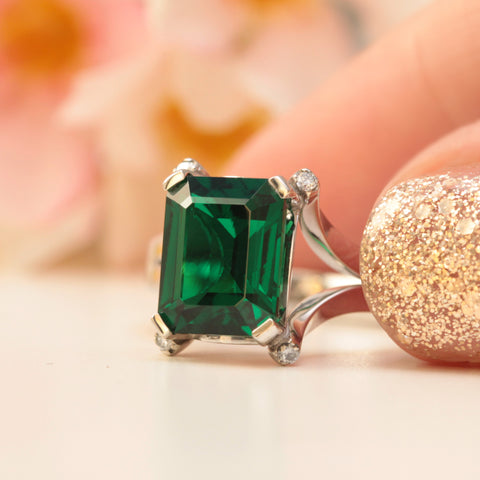 ethical lab created emerald and diamond engagement ring