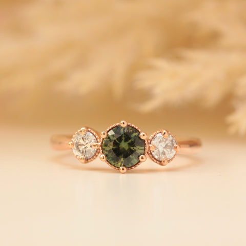 green sapphire and diamond engagement ring in rose gold