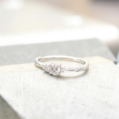 leaf and flower engagement ring in white gold