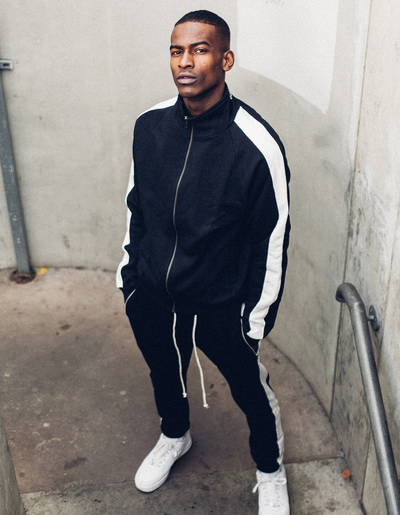 black tracksuit with white stripe