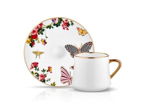 White coffee cups with butterfly and flower patterns