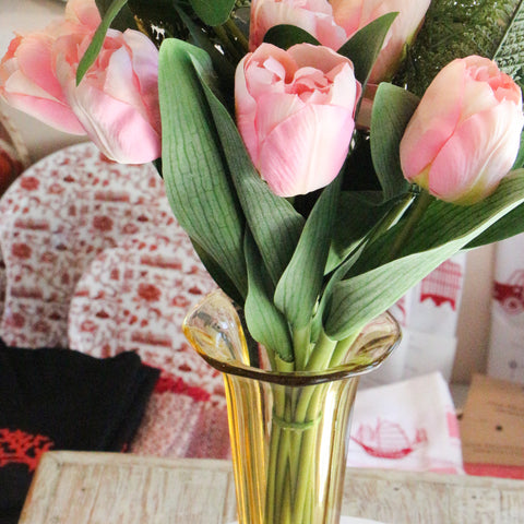 fake tulips in a vintage vase