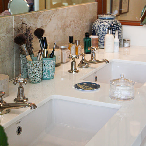 bathroom with glass container 