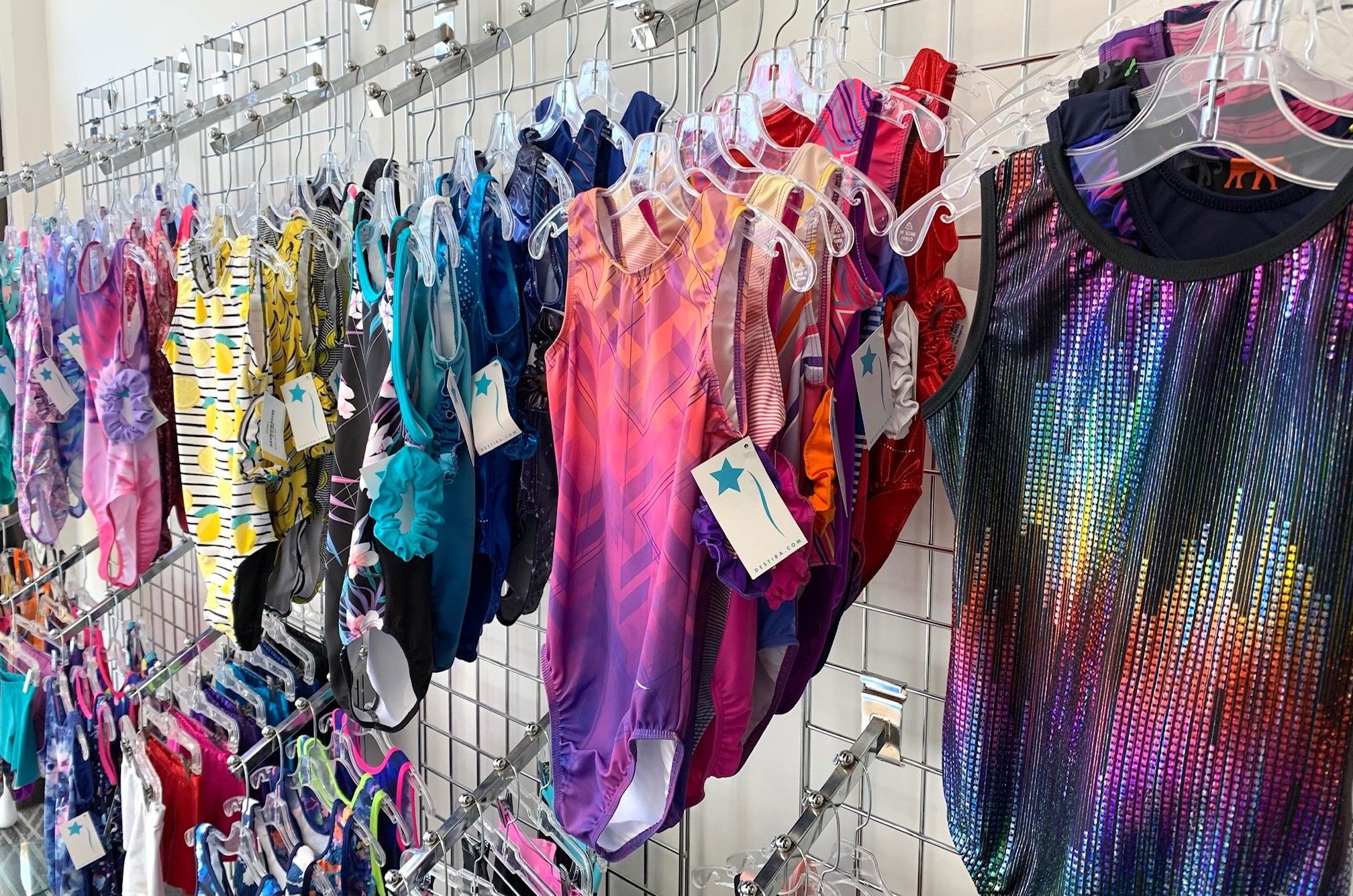 Gymnastics leotard display with Desitra leotards, 2023