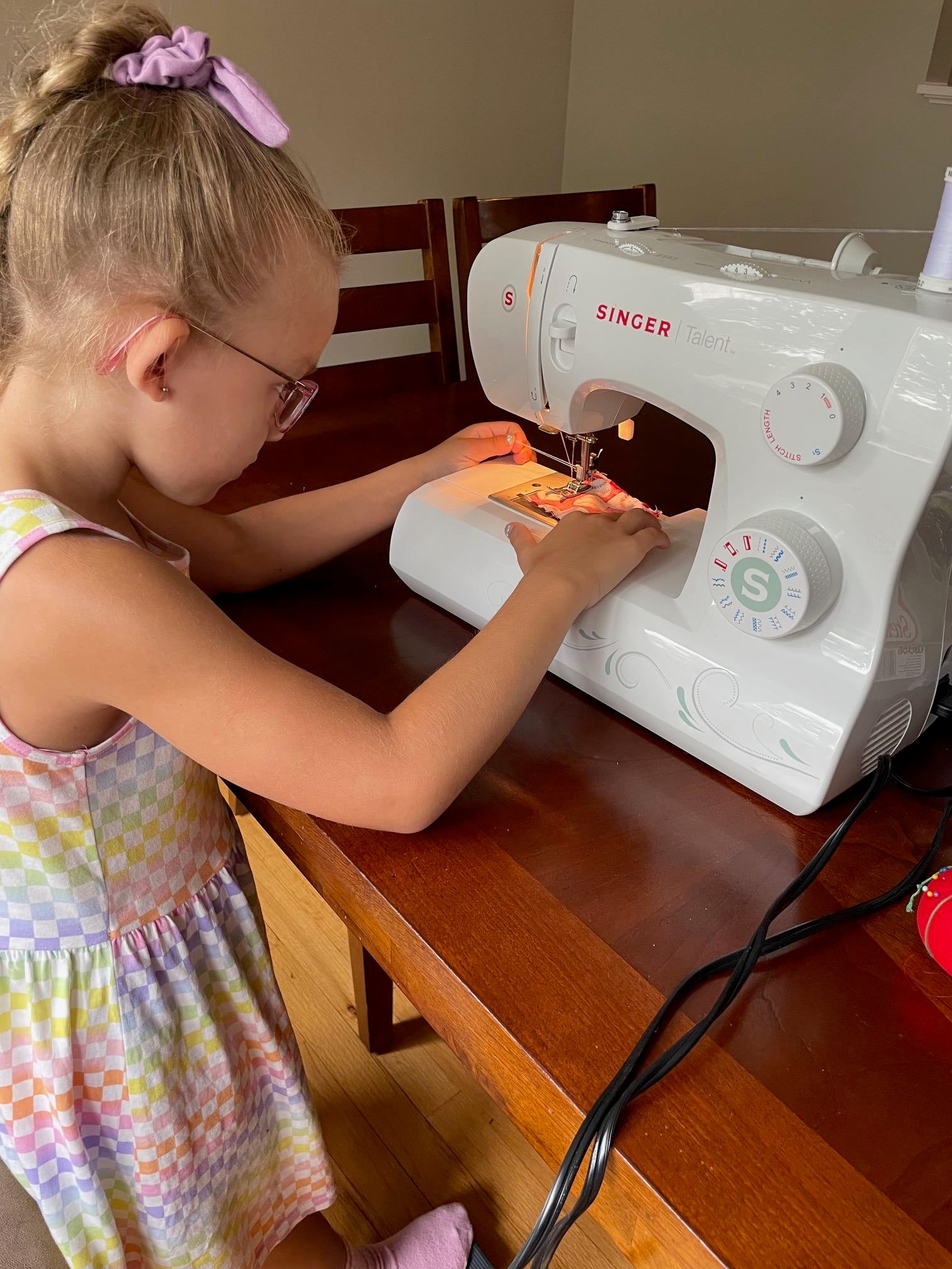 Claire sewing at her sewing machine