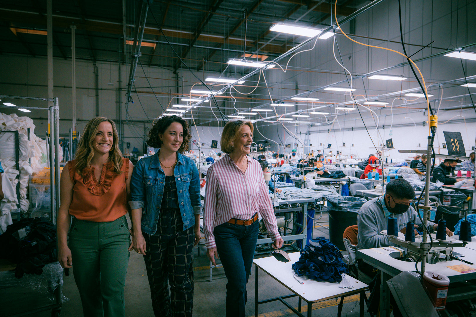 Jen, Jodi, and Donna walk through a factory making gymnastics leotards, Destira, 2023