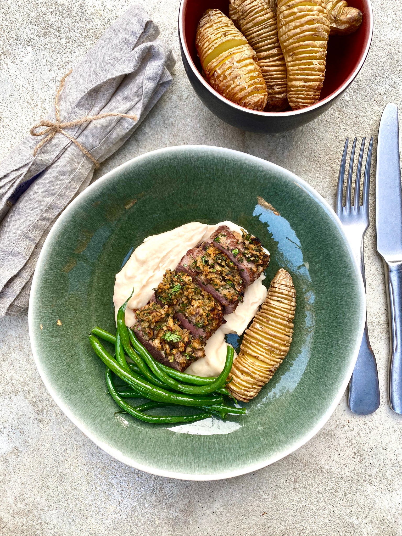 Herb-Crusted Cannons of Lamb with Butterbean Mash & Hasselback Potatoes Recipe