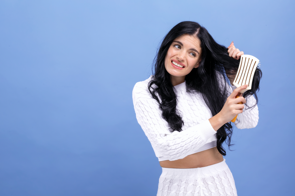 woman untangling hair