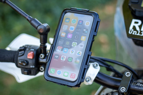 Phone case mounted to motorcycle handlebar