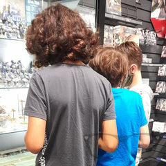 The boys look at the display shelves at Games Workshop Warhammer, Nottingham
