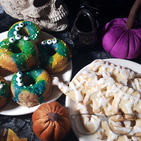 Monster donuts and dinosaur skeleton biscuits ready for the spooky party