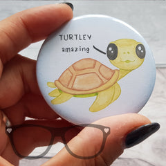 58mm badge showing a cute turtle that says "Turtley Amazing" on a white background