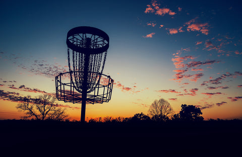 Disc golf basket as the sun goes down