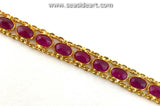 18K yellow gold line style bracelet set with 28 mixed oval cut natural rubies.