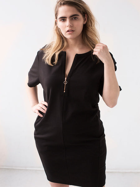 See ROSE Go Plus Size Blond Model wearing LBD with rose gold zipper made in cooling, wicking fabric invested by See ROSE Go founders