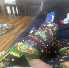 lap view of Lord of the rings themed legging design being worn while lounging on the couch