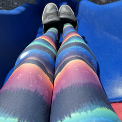 Colorful leggings being worn at the park.