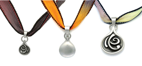 Annika Rutlin storm inspired reversable silver jewelry pendants