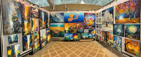 Nelson Makes Art booth at ArtFest Midwest art show in Des Moines, Iowa. Art festival booth with 3 walls covered in colorful tropical paintings