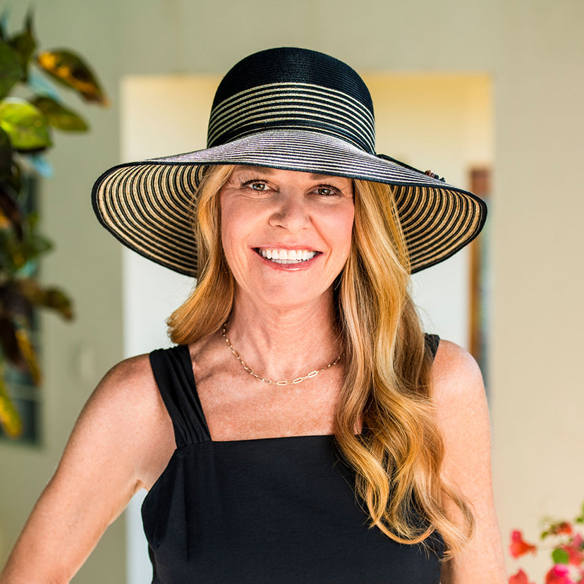 Woman Smiling while Wearing a Wallaroo Marseille summer Sun Hat in a Garden