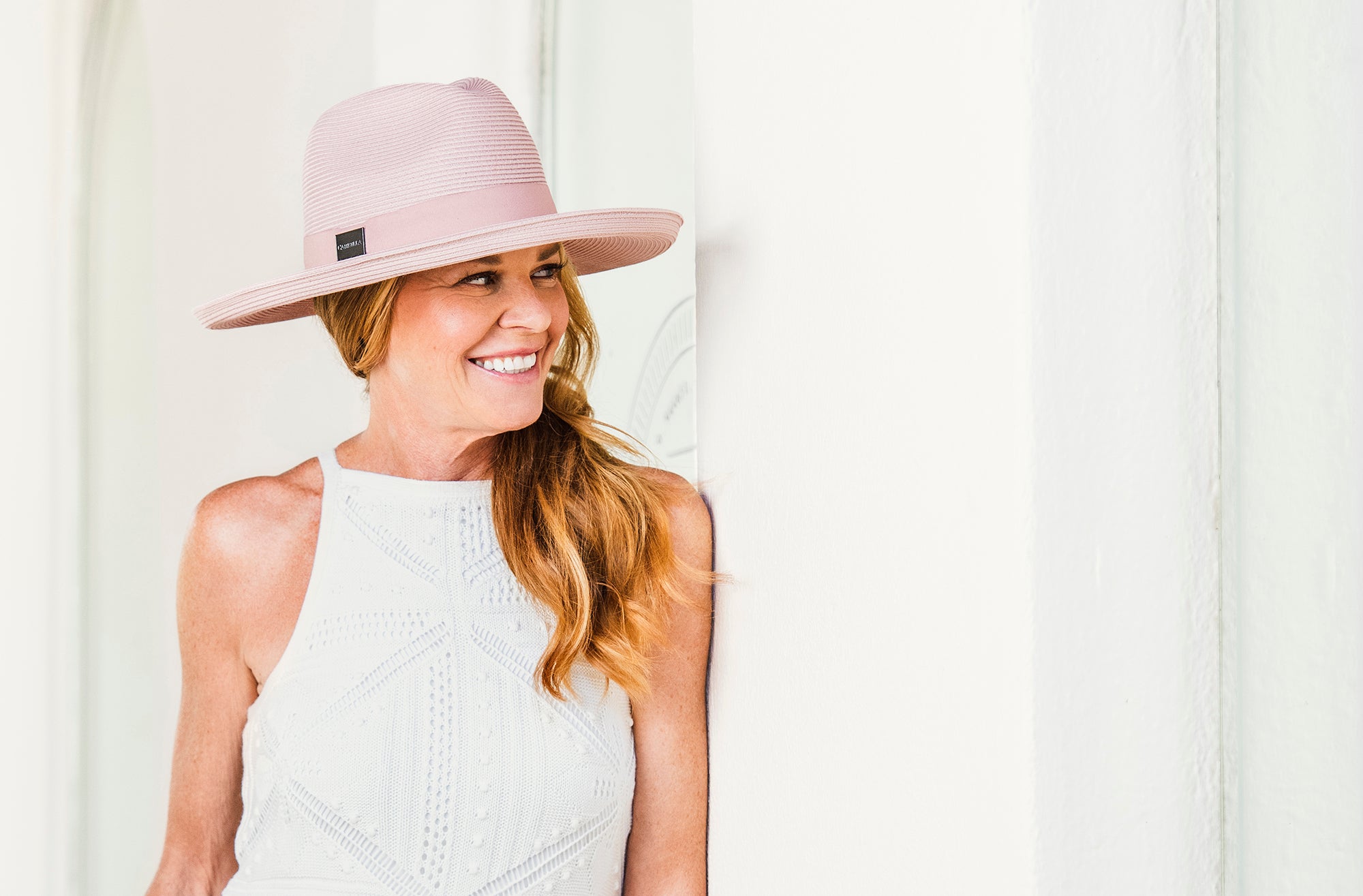 Women posing in a Carkella Vivian, a big wide brim Fedora fall/winter sun cap 