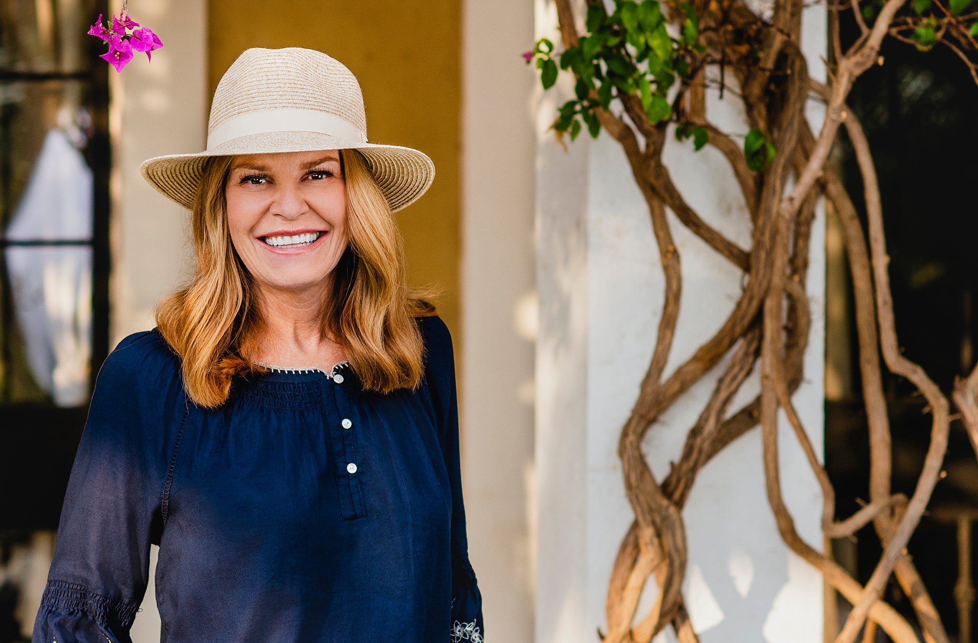 Woman Wearing a Wallaroo Caroline summer beach cap outside