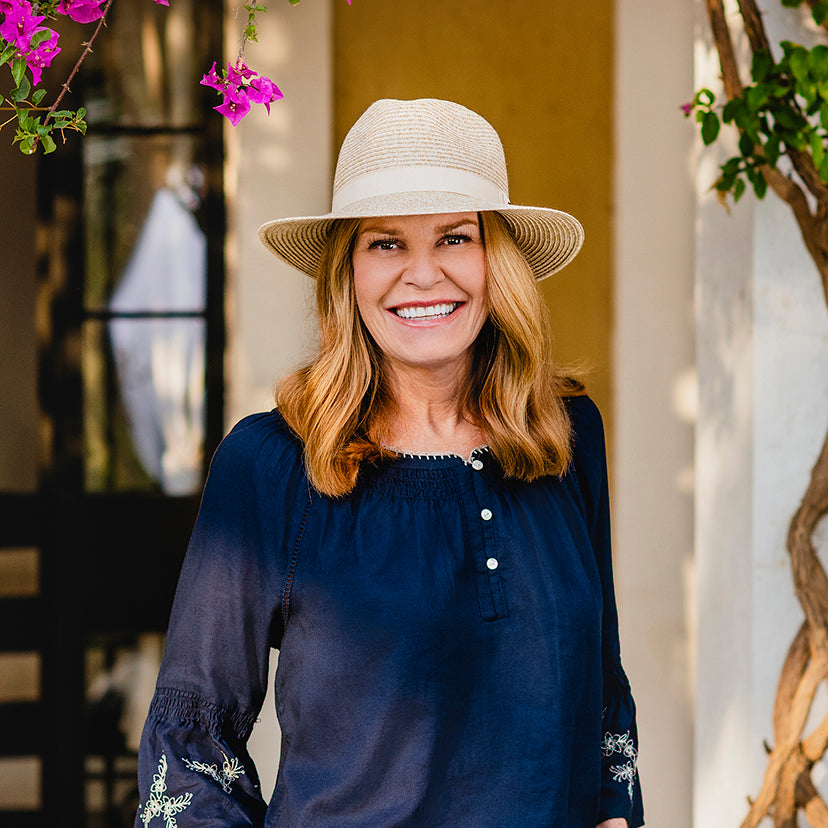 Woman Wearing a Wallaroo Caroline summer beach cap outside