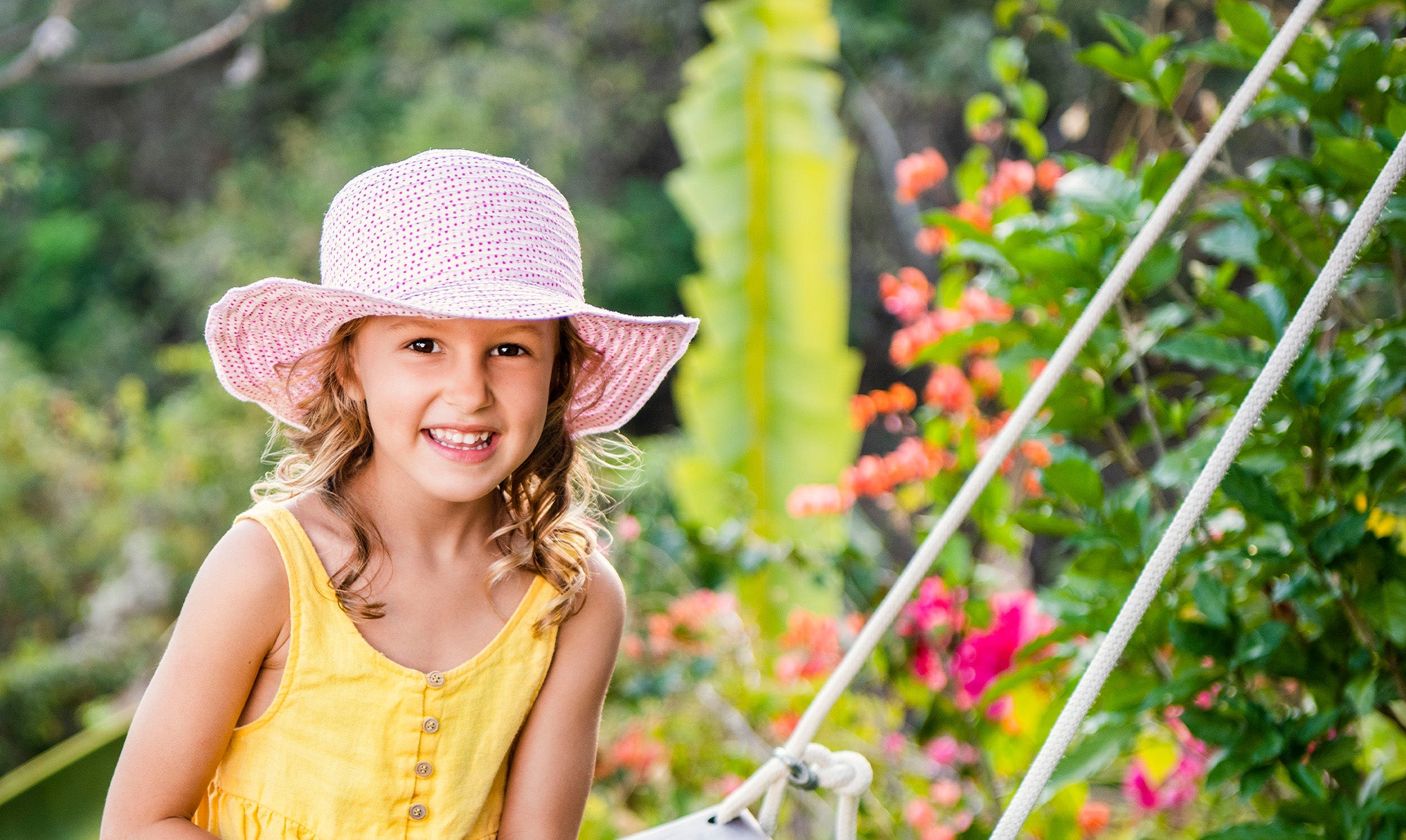 Girl on a Swing Wearing Wallaroo Kids Scrunchie Polyester Sun Hat