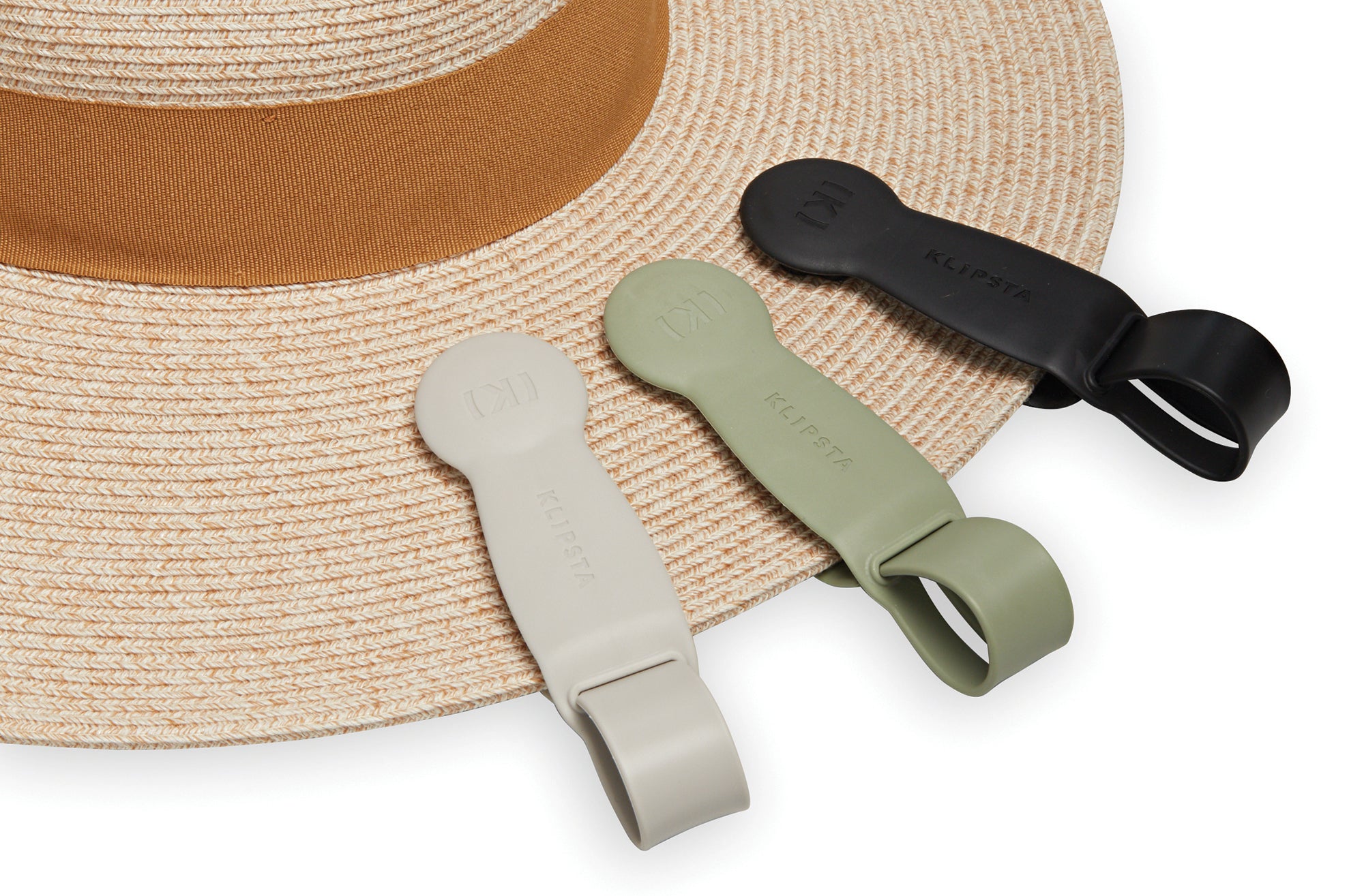 Wallaroo St. Lucia sun hat holding three colors of Klipsta hat clips