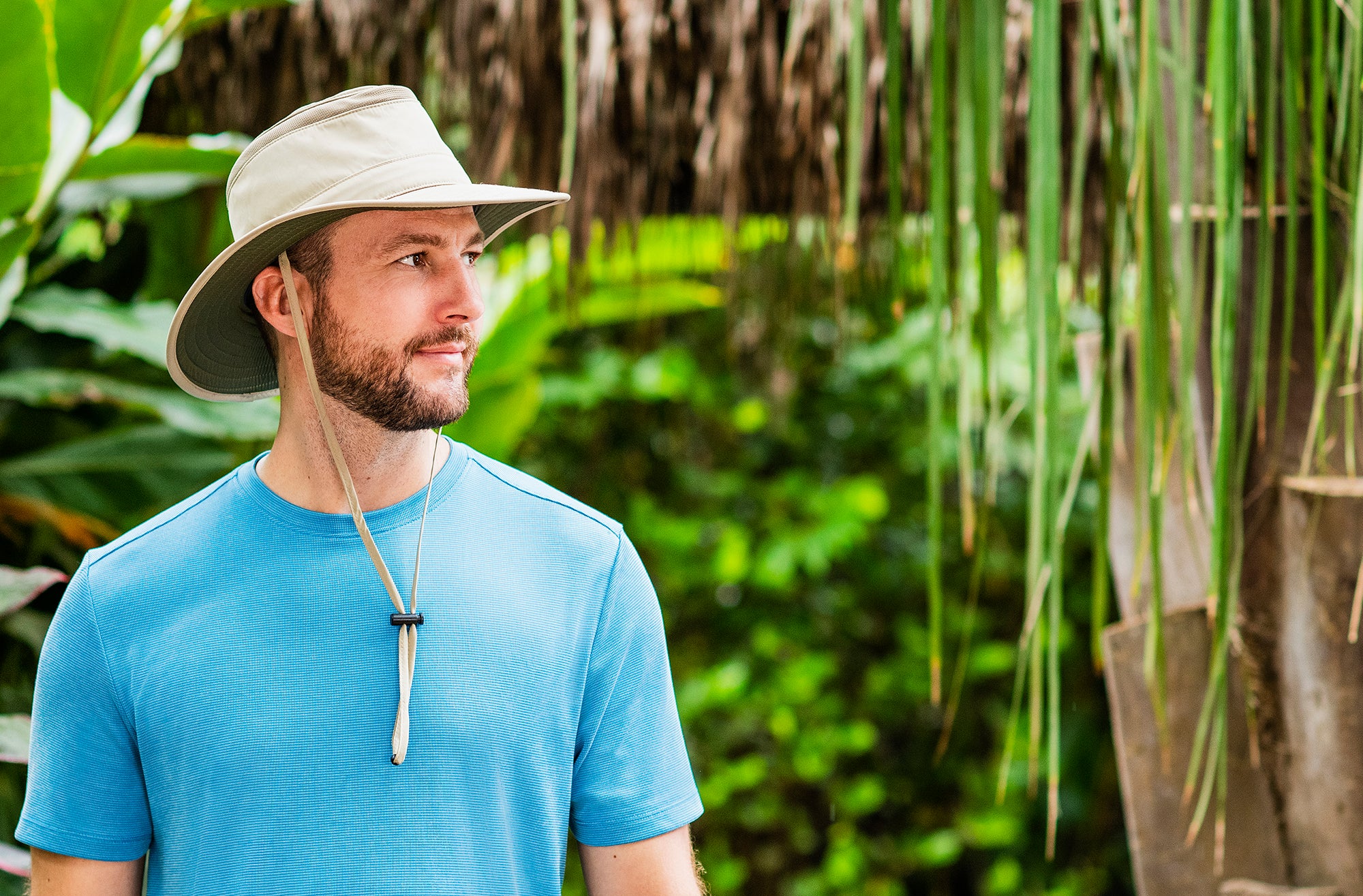 Man outdoors with the Summit summer sun hat by Wallaroo, with uv protection designed for travel