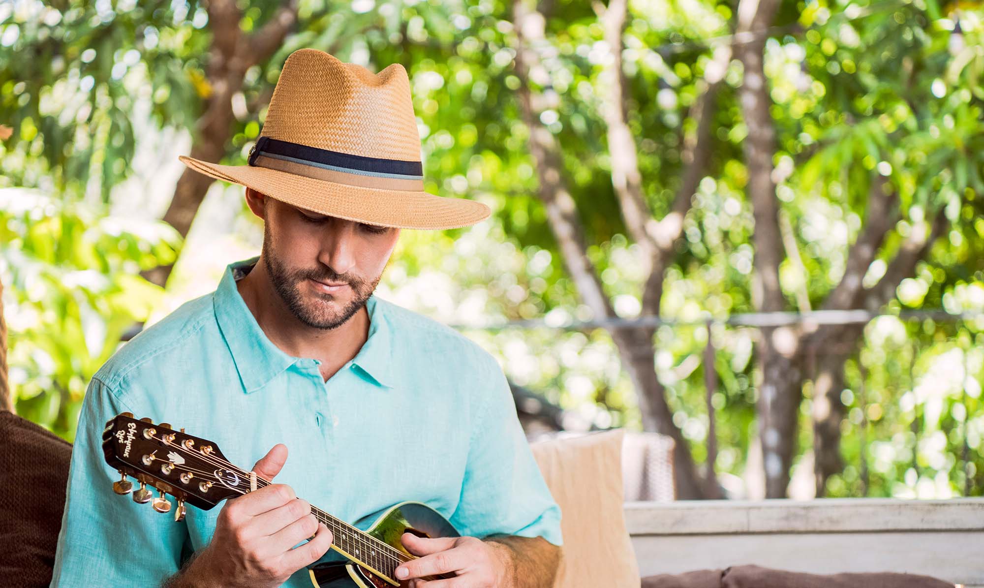 Man Wearing the Wallaroo Turner, a summer sun hat with uv protection and a big wide brim