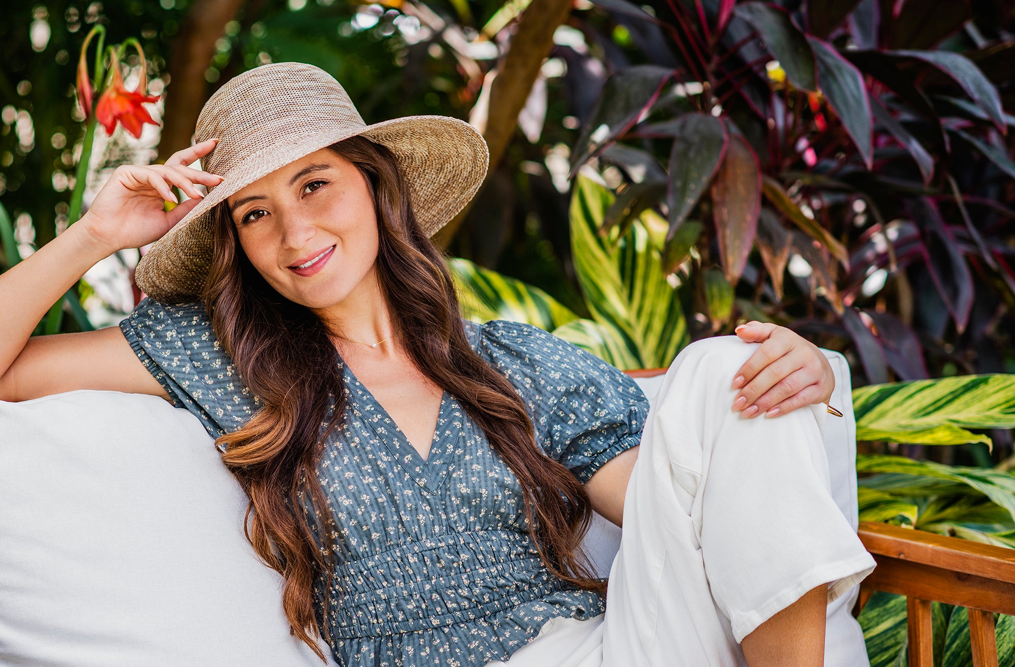 Woman wearing a Wallaroo Victoria Diva summer sun hat with a big wide brim 