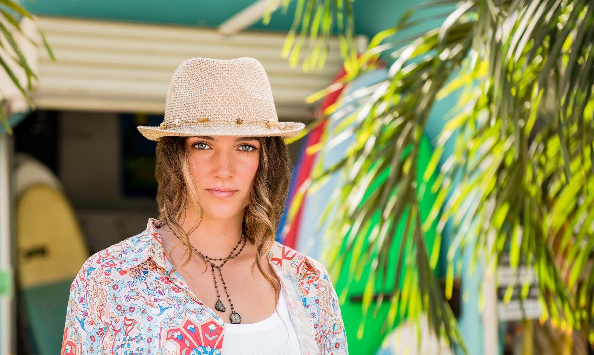 Woman Wearing a Wallaroo Waverly Beach Sun Hat for travel