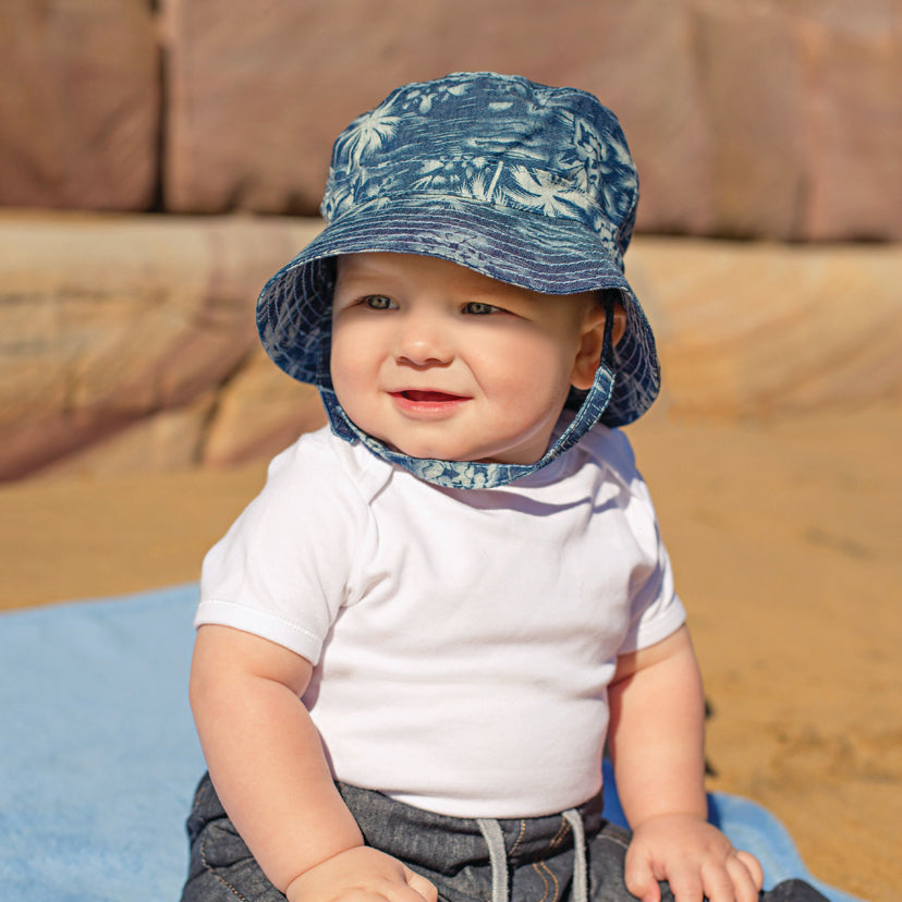 Child Wearing an adventure bucket Aloha sun hat with Chinstrap in Denim