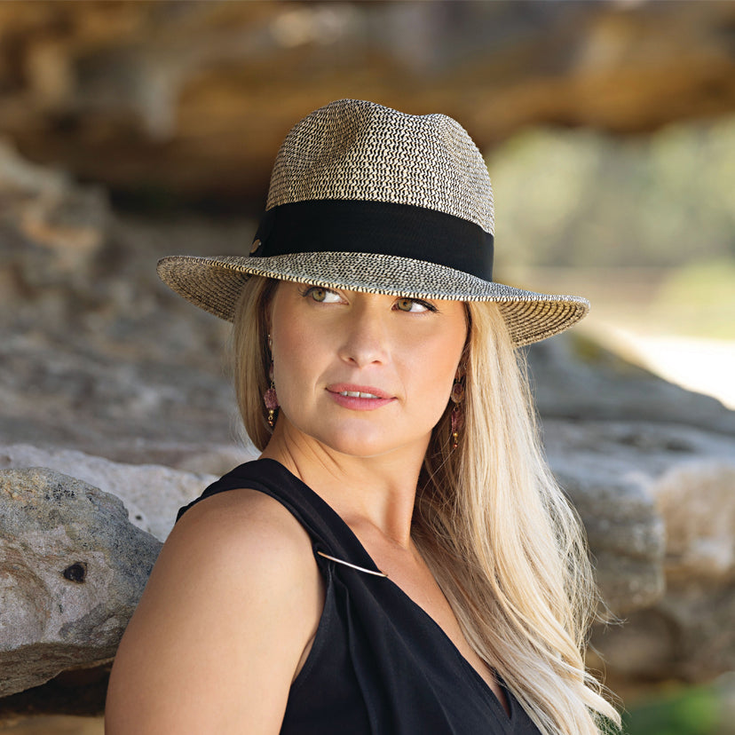 Woman wearing the stylish Josie Summer cap for ladies designed for travel