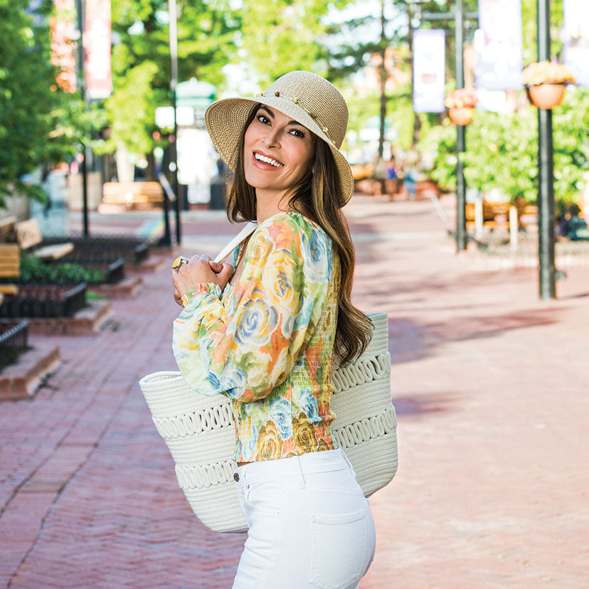 Woman Wearing a Wallaroo Naomi Summer Sun Cap In the City