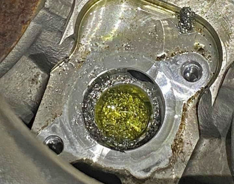 Damaged CP4 Pump aftermath showing metal shavings