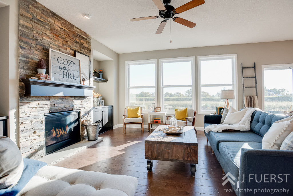 new construction living room | reupholstered sofa | handcrafted coffee table wood with casters | rustic industrial | modern farmhouse |cjc@home | Carver Junk Company's Staged Home Shopping Event | Victoria, MN | Home Staging | Modern Fall Farmhouse | Fixer Upper Style | carverjunkcompany.com