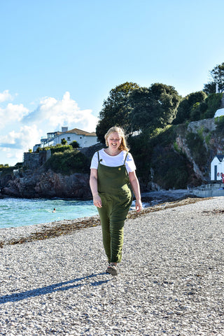 Photo of Sarah Frances walking on the beach.