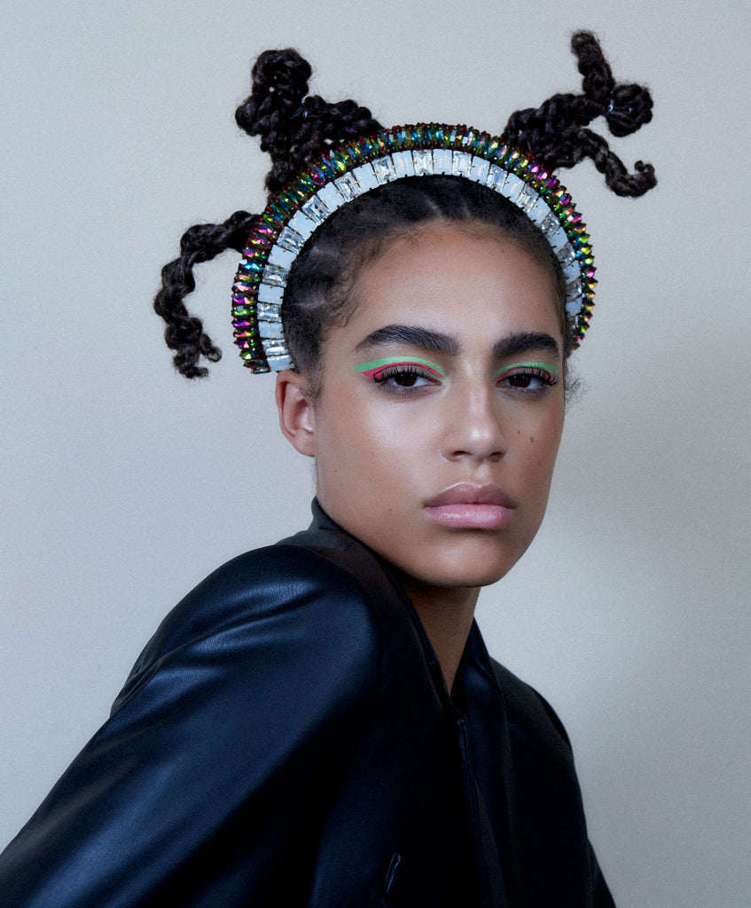 A model wearing Jolita Jewellery's statement necklace styled as a headpiece