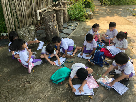 Participants filling in their camp journals