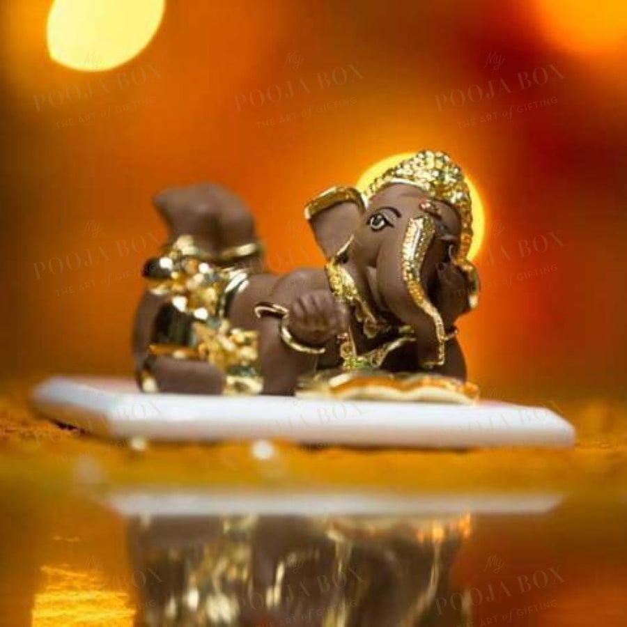 Buy Unique Clay Bal Ganesha Showpiece on Marble Base Online in ...