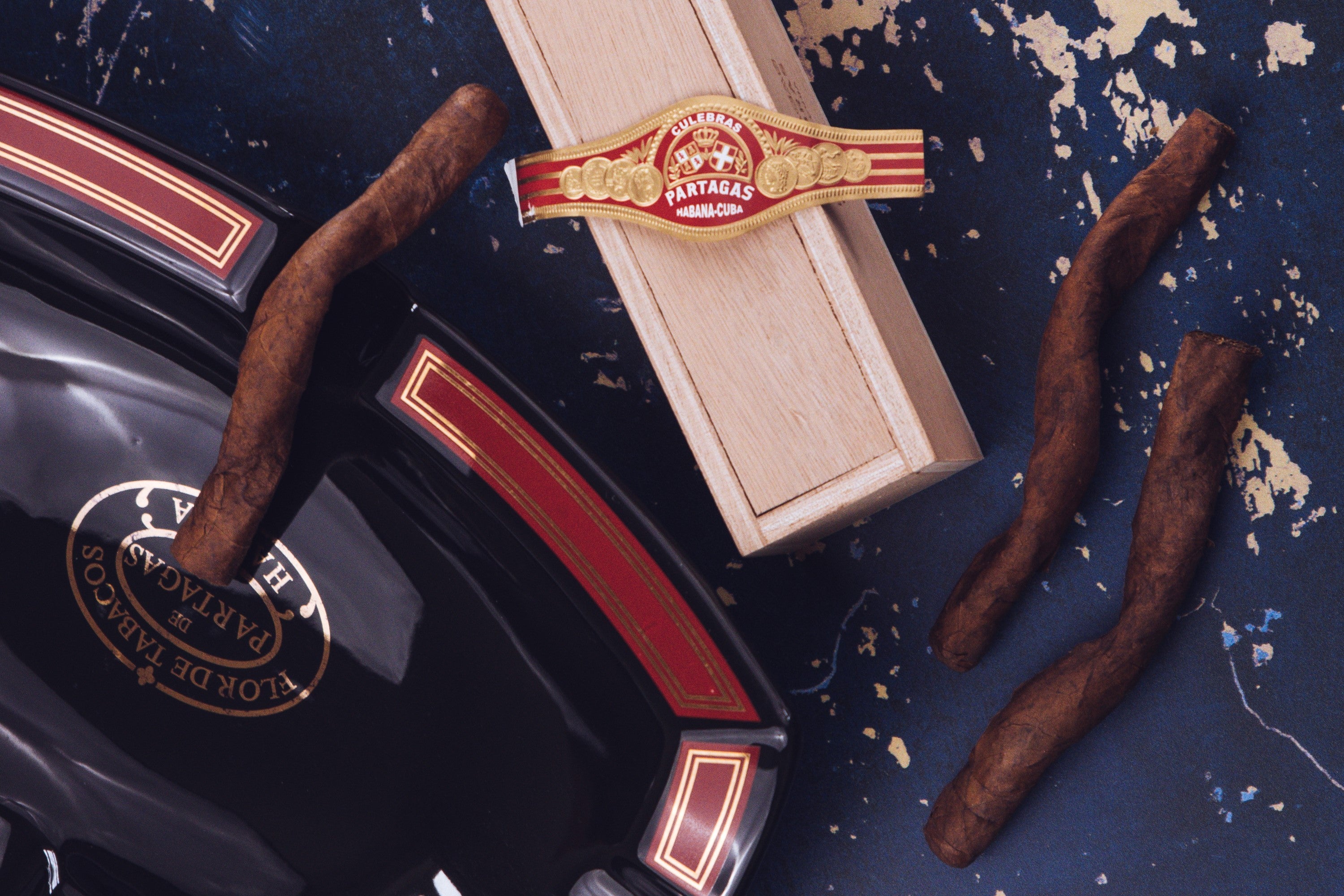 A trio of Partagas Culebras split and ready to be smoked.